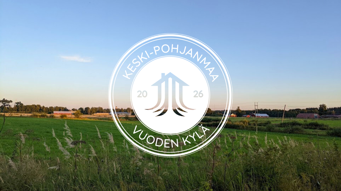 peltomaisema jonka päällä vuoden kylä logo
